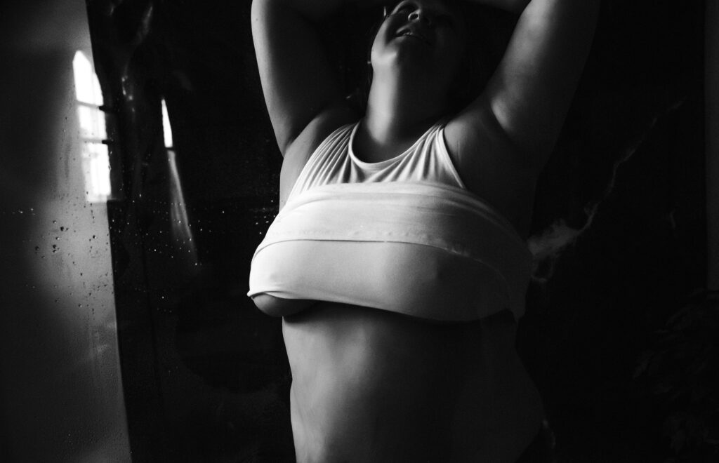 black and white woman in Minneapolis studio with a wet tank top
